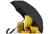 Stack of coins under an umbrella