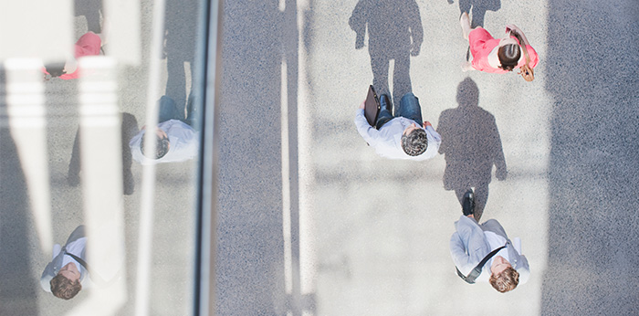 People passing on street - overhead view