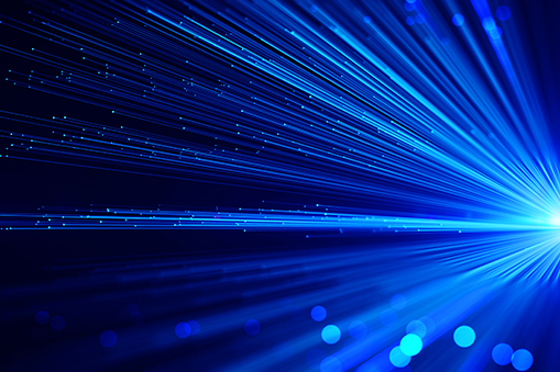 Blue light streaks extending diagonally across a dark background