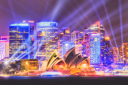 Sydney skyline at night with illuminated buildings and waterfront