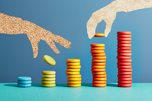 Colorful coin stacks with abstract hands