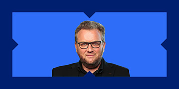 Headshot of Christopher Joyce from Coolabah in a blue x-frame