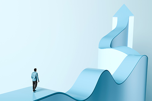 Man Facing Winding Path Toward Arrow Structure