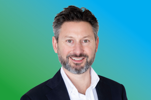 Matt Heine against a blue and green background