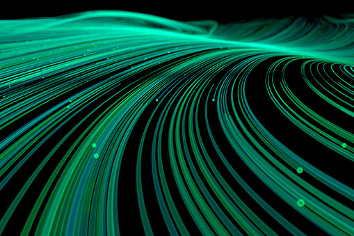 Abstract teal light trails on dark background